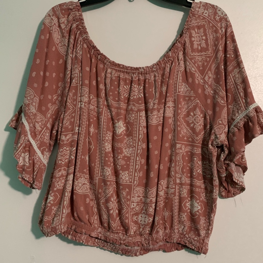Pink off the shoulder shirt with designs